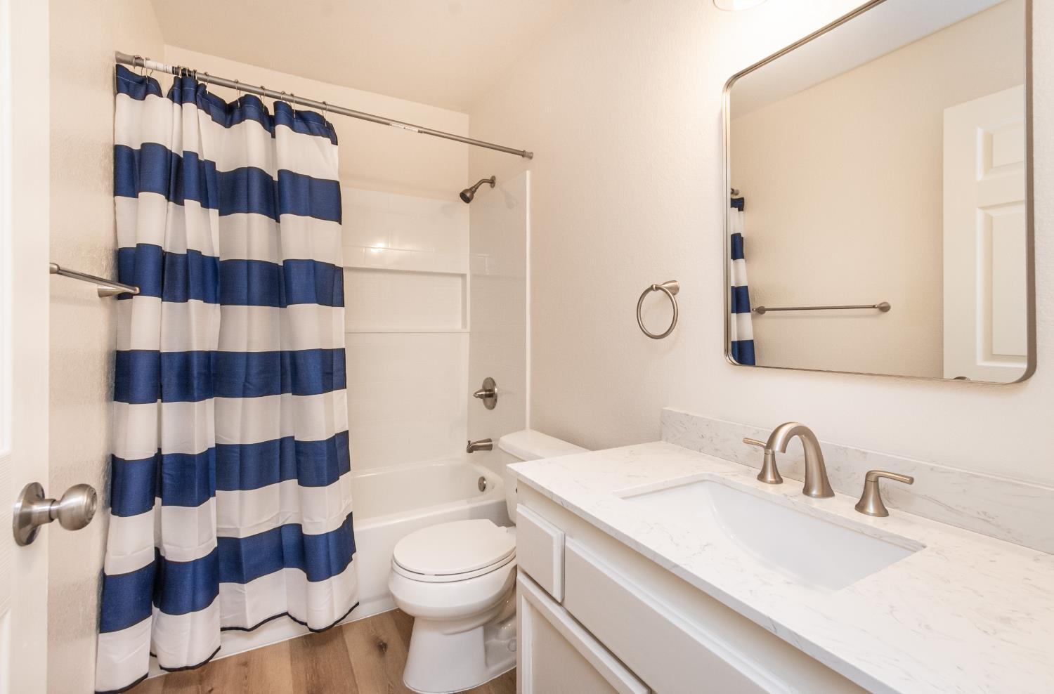 8245 Calleystone Way Antelope, CA 95843 - Photo 15 of 33 a bathroom with a sink a toilet and shower