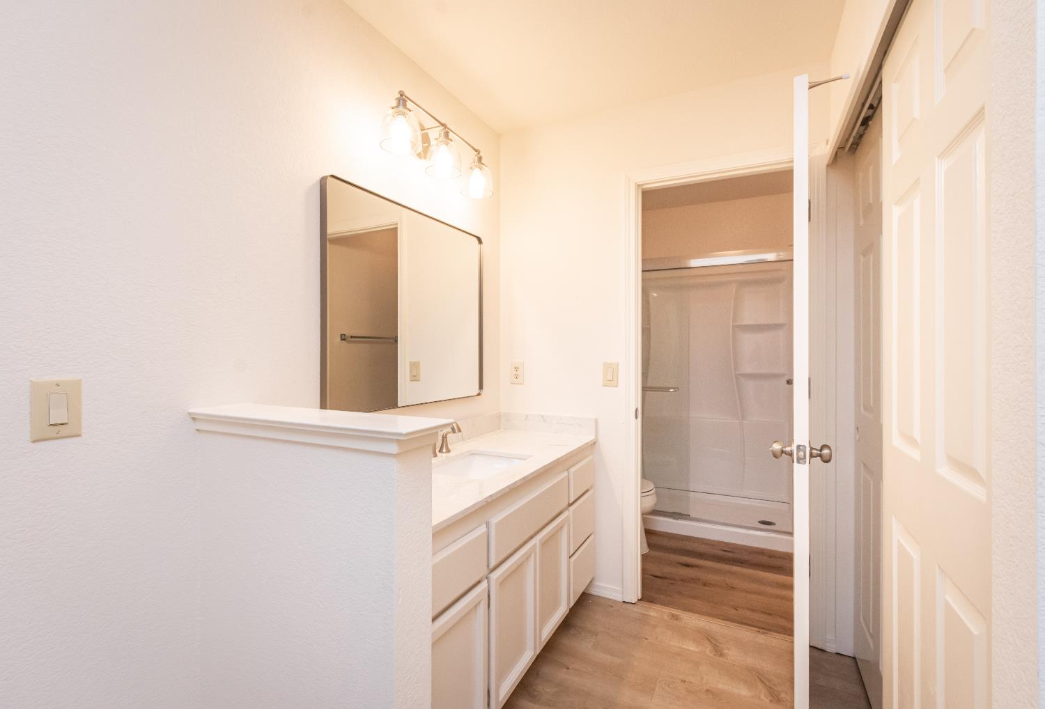 8245 Calleystone Way Antelope, CA 95843 - Photo 24 of 33 a bathroom with a granite countertop sink and a mirror