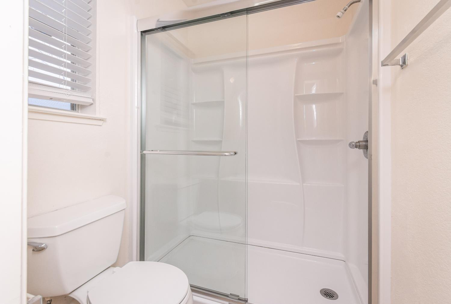 8245 Calleystone Way Antelope, CA 95843 - Photo 26 of 33 a bathroom with a toilet and a shower