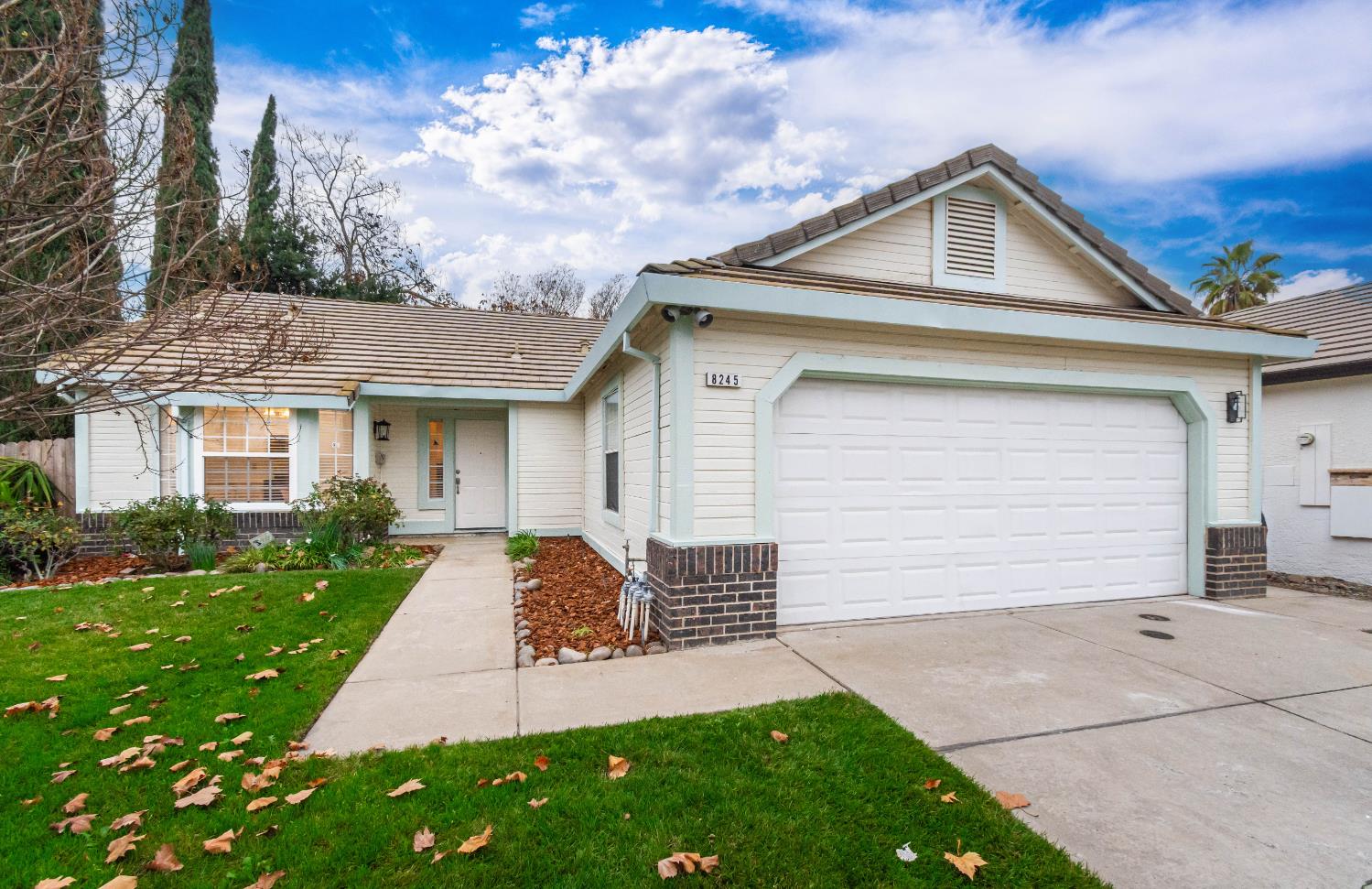 8245 Calleystone Way Antelope, CA 95843 - Photo 31 of 33 a front view of a house with a yard and garage