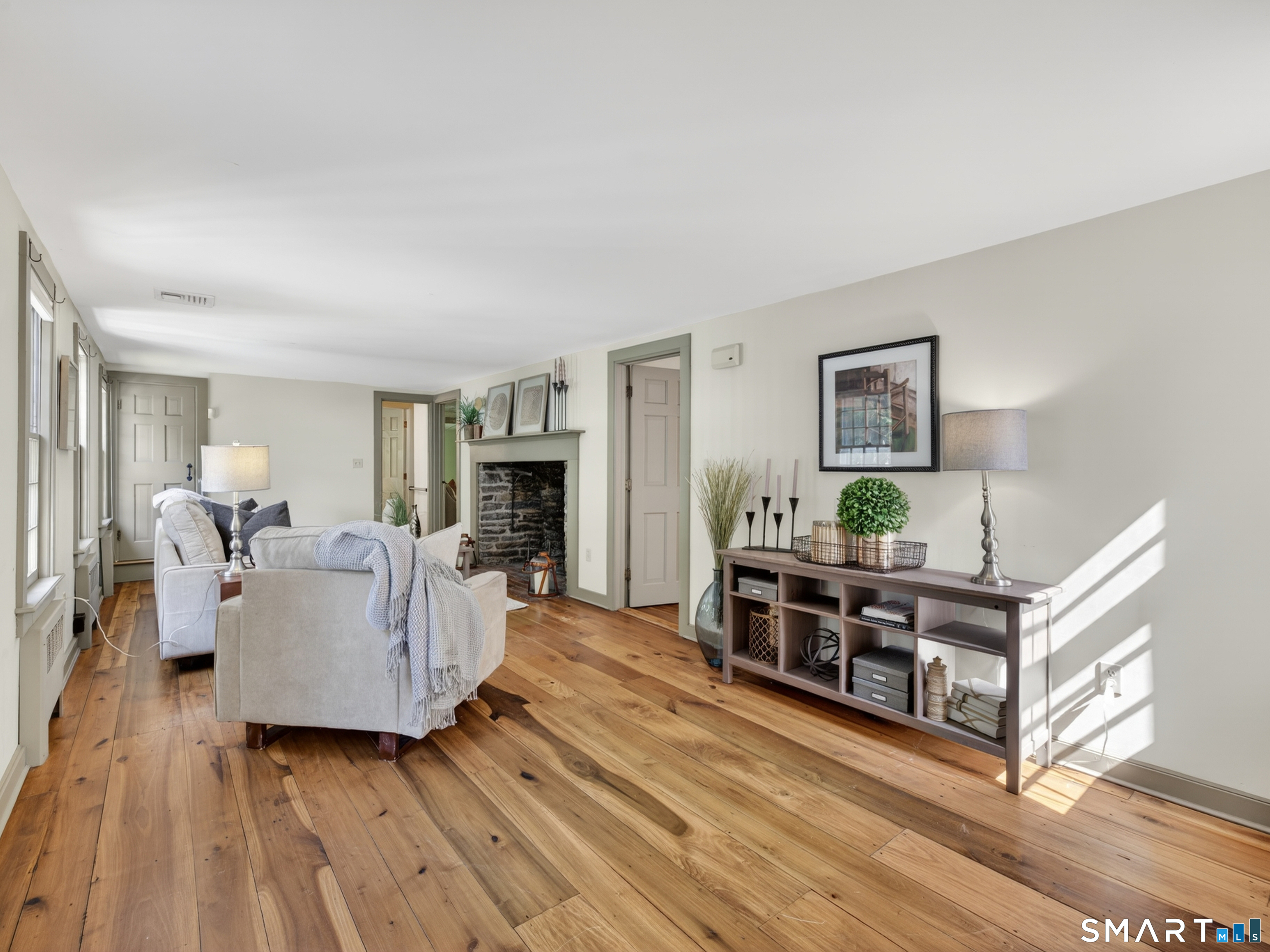 14 Cow Pen Hill Road Killingworth, CT 06419 - Photo 13 of 40 Seamlessly connected to the living room, the family room is anchored by a charming hearth fireplace and filled with timeless character.