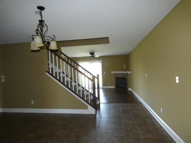 a view of a hallway with windows