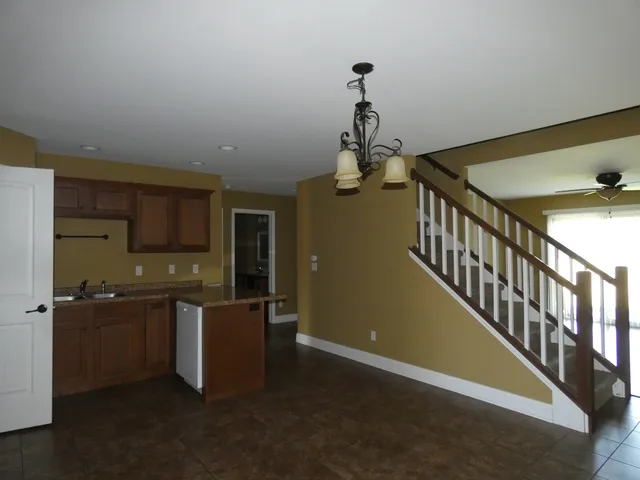 a view of a storage & utility room with a sink