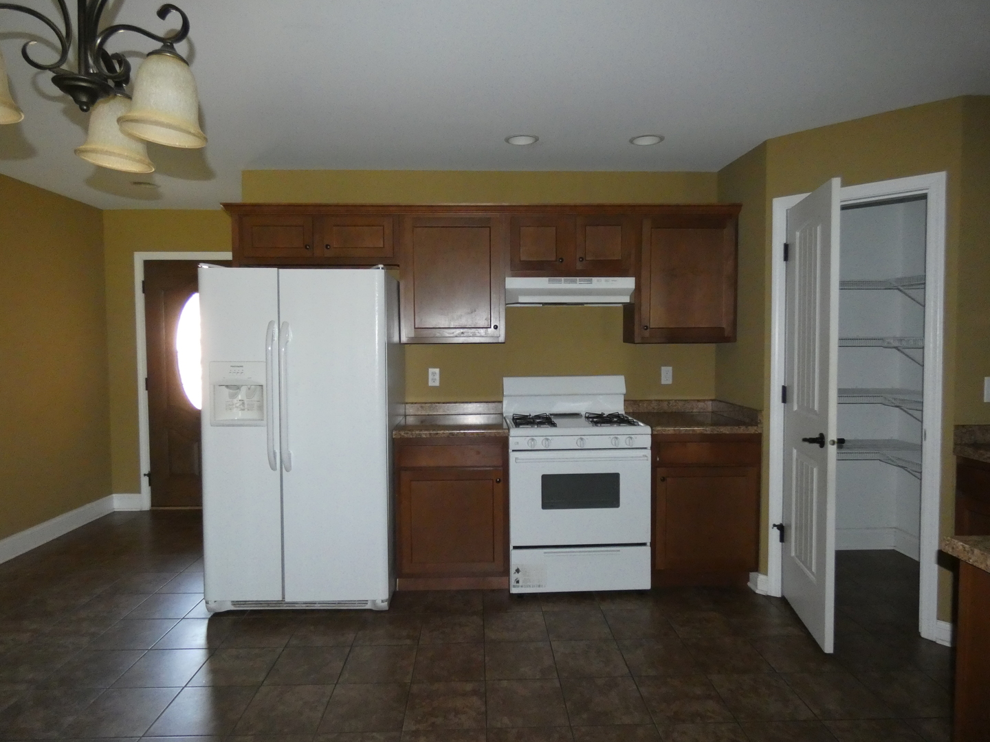 627 North Edgemere Drive Bourbonnais, IL 60914 - Photo 17 of 37 a kitchen with a refrigerator sink and cabinets