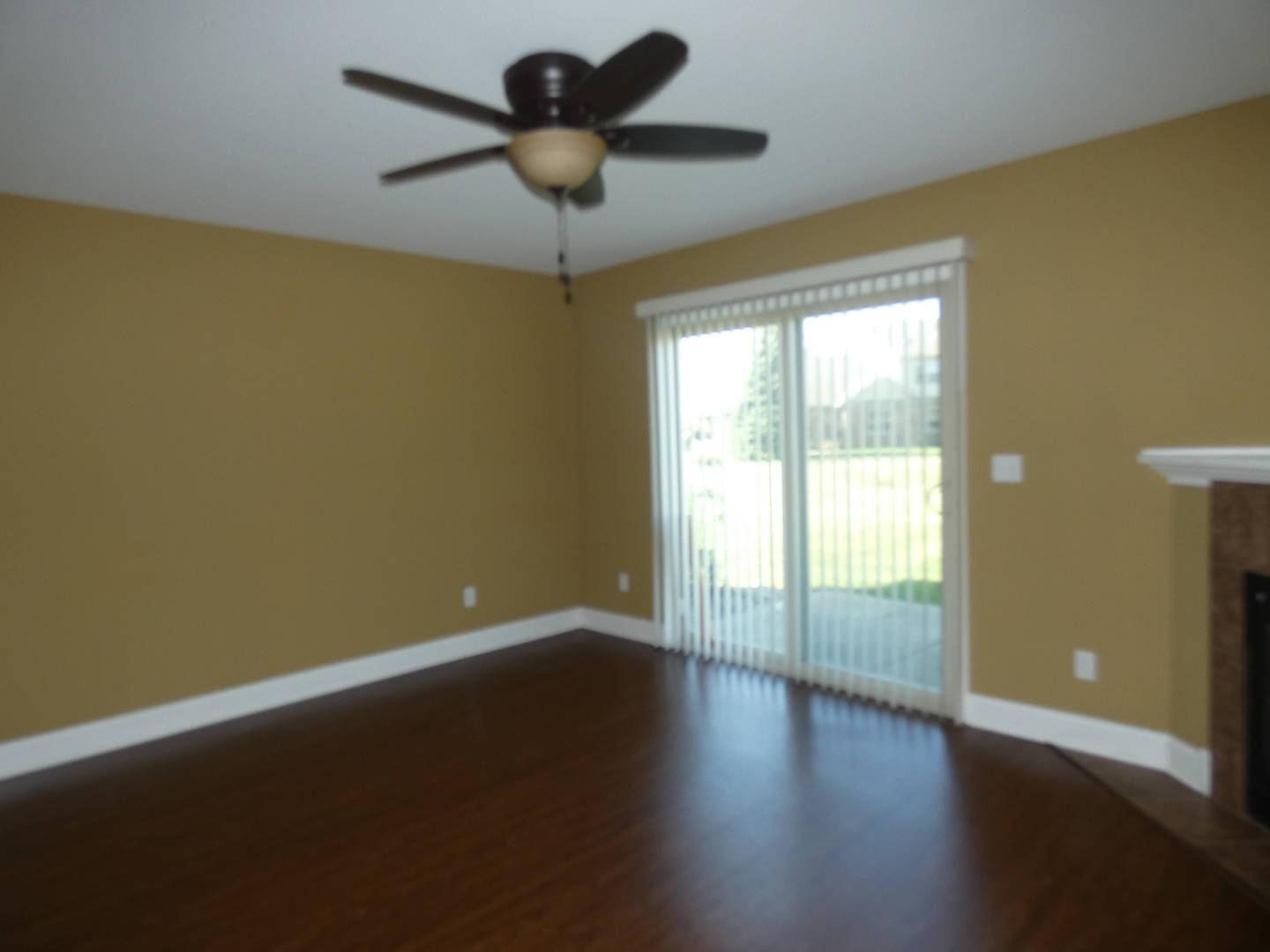 627 North Edgemere Drive Bourbonnais, IL 60914 - Photo 34 of 37 an empty room with wooden floor and windows