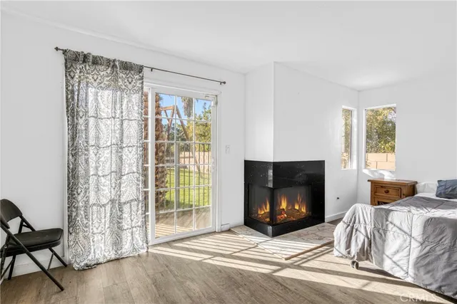 a bedroom with a bed and a fireplace