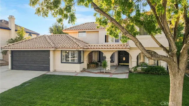 a front view of house with yard and outdoor seating