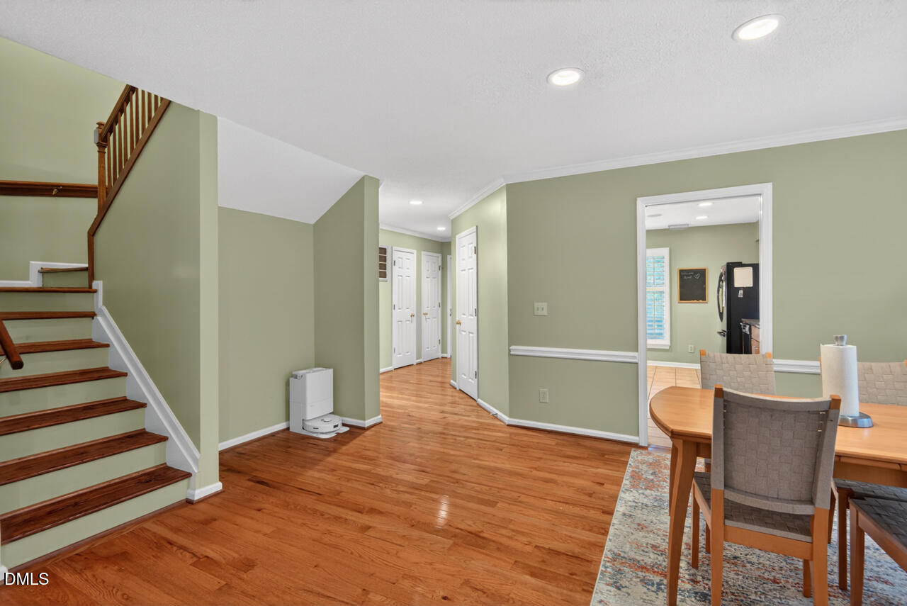 3307 Coachman's Way Durham, NC 27705 - Photo 13 of 50 a workspace with wooden floor and furniture