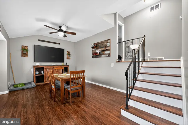 a view of a livingroom with furniture and wooden floor