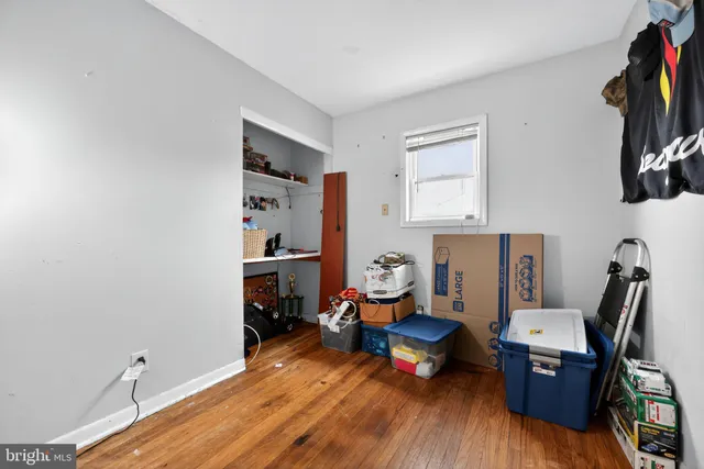 a living room with furniture a window and a flat screen tv