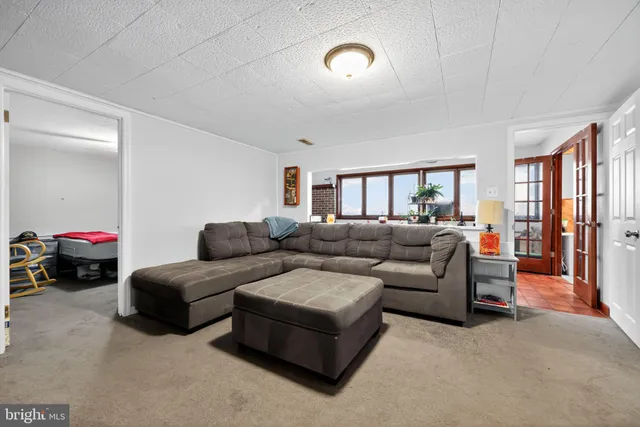 a living room with furniture and a gate