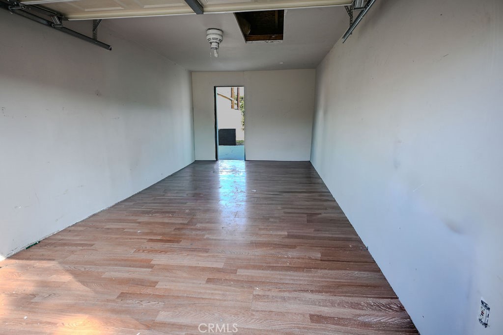 827 East 103rd Place Los Angeles, CA 90002 - Photo 16 of 18 Garage interior w/backdoor