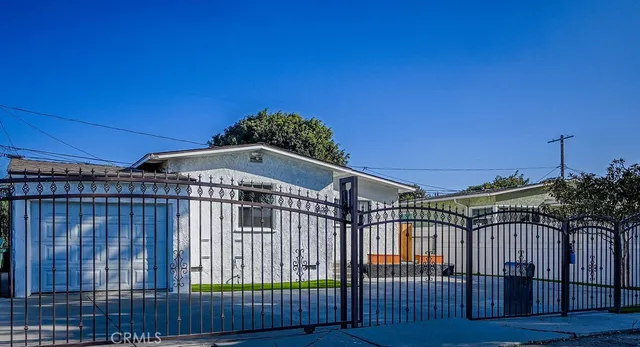 a view of a roof deck with wooden fence