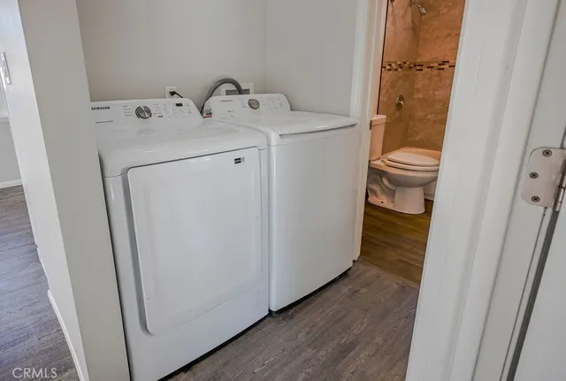 a view of bathroom with a washer and dryer