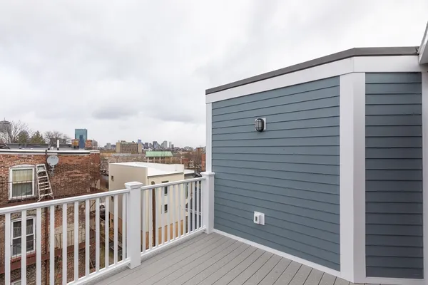 a view of a balcony with city view