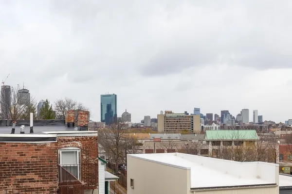 a view of a city with tall buildings in the background