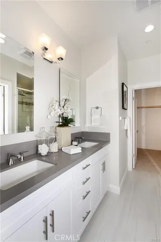 a bathroom with sink and mirror