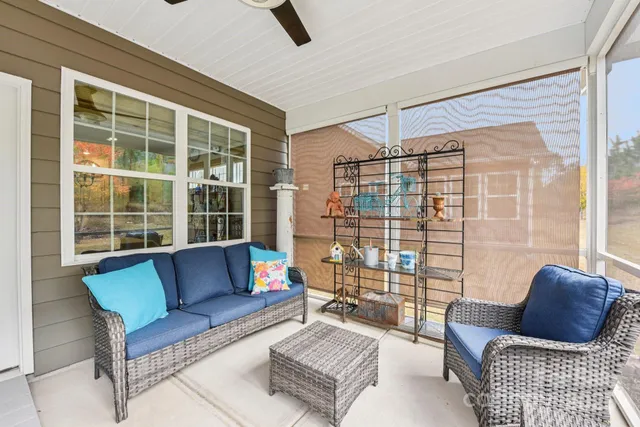 a view of a patio with table and chairs and potted plants