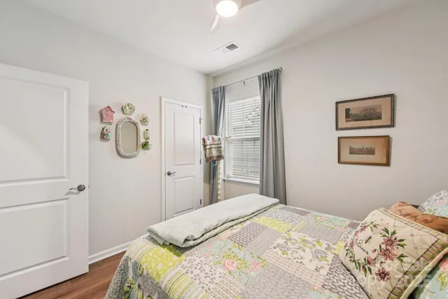 a living room with fireplace furniture and a flat screen tv