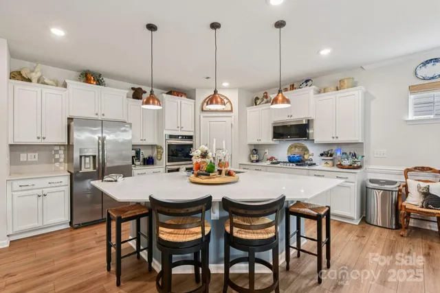 a view of kitchen with cabinets and wooden floor