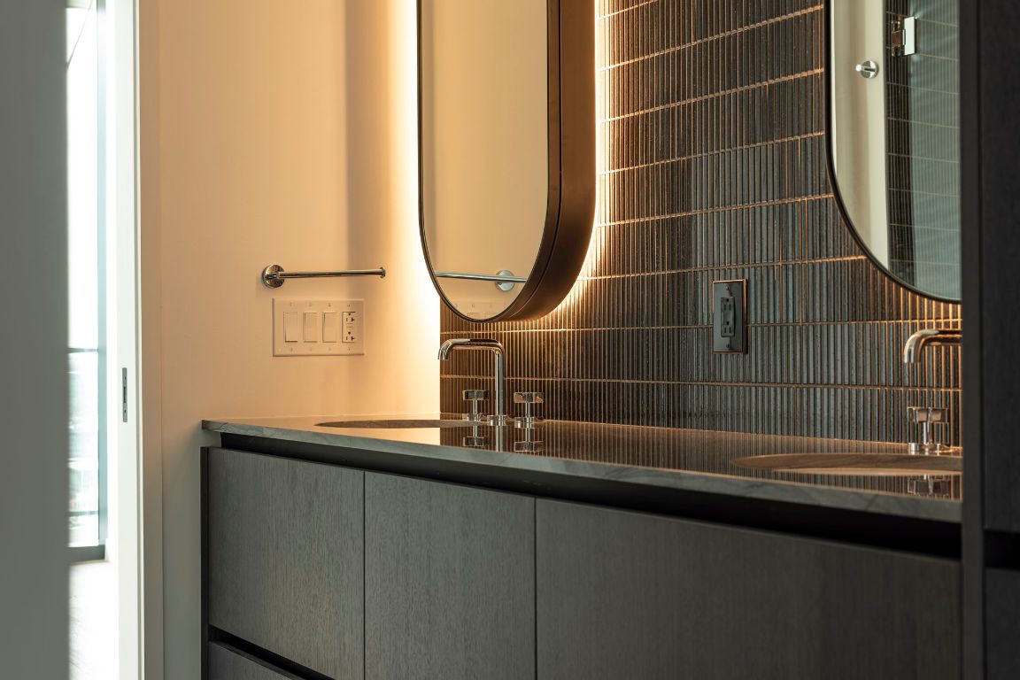 610 Davis Street, Unit 2812 Austin, TX 78701 - Photo 12 of 32 a bathroom with a sink and a mirror