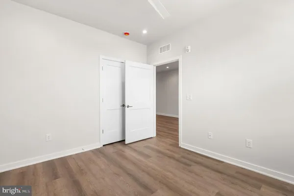 a bathroom with a double vanity sink toilet and shower