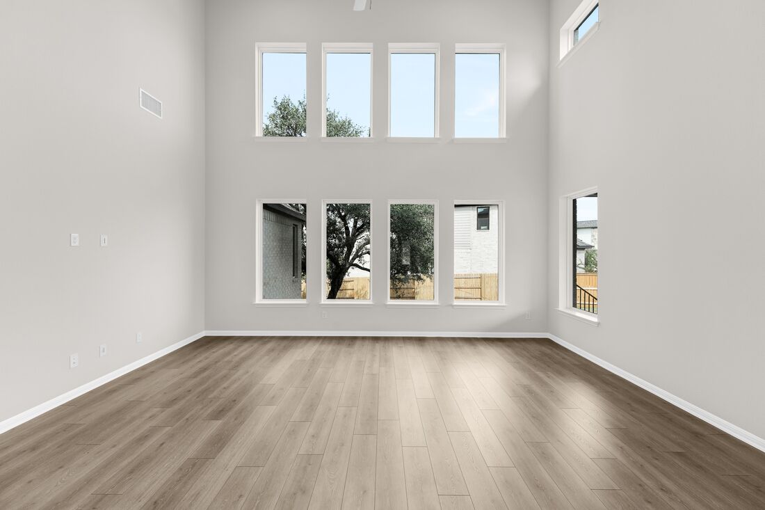 1821 Plum Tree Way Georgetown, TX 78628 - Photo 19 of 35 a view of an empty room with wooden floor and a window