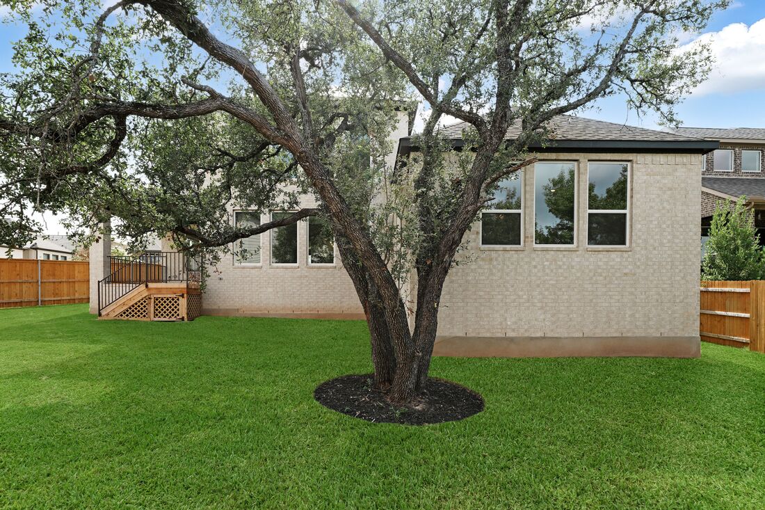 1821 Plum Tree Way Georgetown, TX 78628 - Photo 20 of 35 a front view of a house with garden