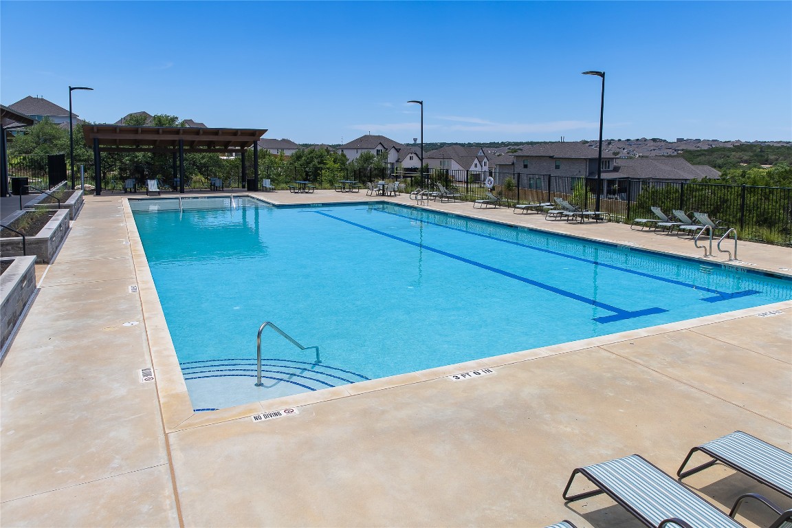 1821 Plum Tree Way Georgetown, TX 78628 - Photo 23 of 35 a view of a swimming pool with a terrace