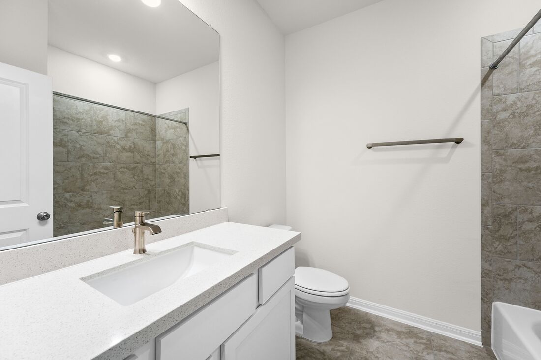 1821 Plum Tree Way Georgetown, TX 78628 - Photo 3 of 35 a bathroom with a sink a toilet and shower