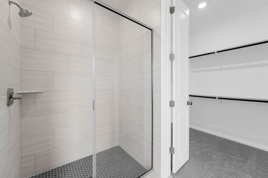 1821 Plum Tree Way Georgetown, TX 78628 - Photo 6 of 35 a bathroom with a shower and a glass door