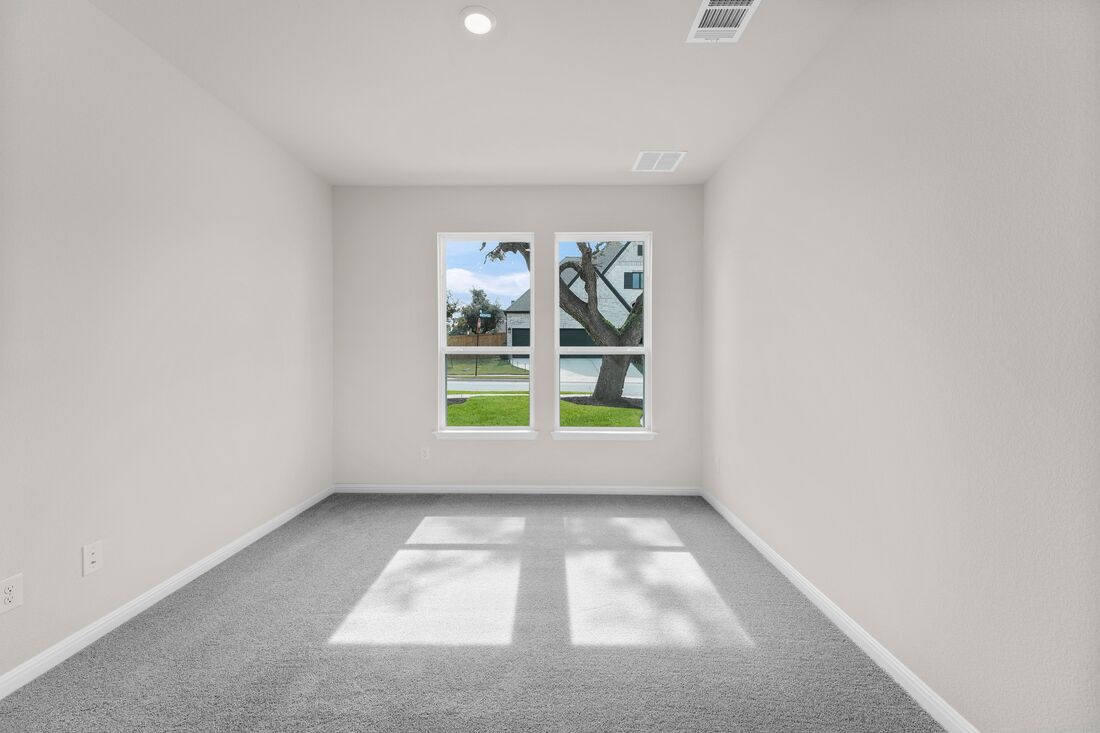 1821 Plum Tree Way Georgetown, TX 78628 - Photo 8 of 35 an empty room with windows