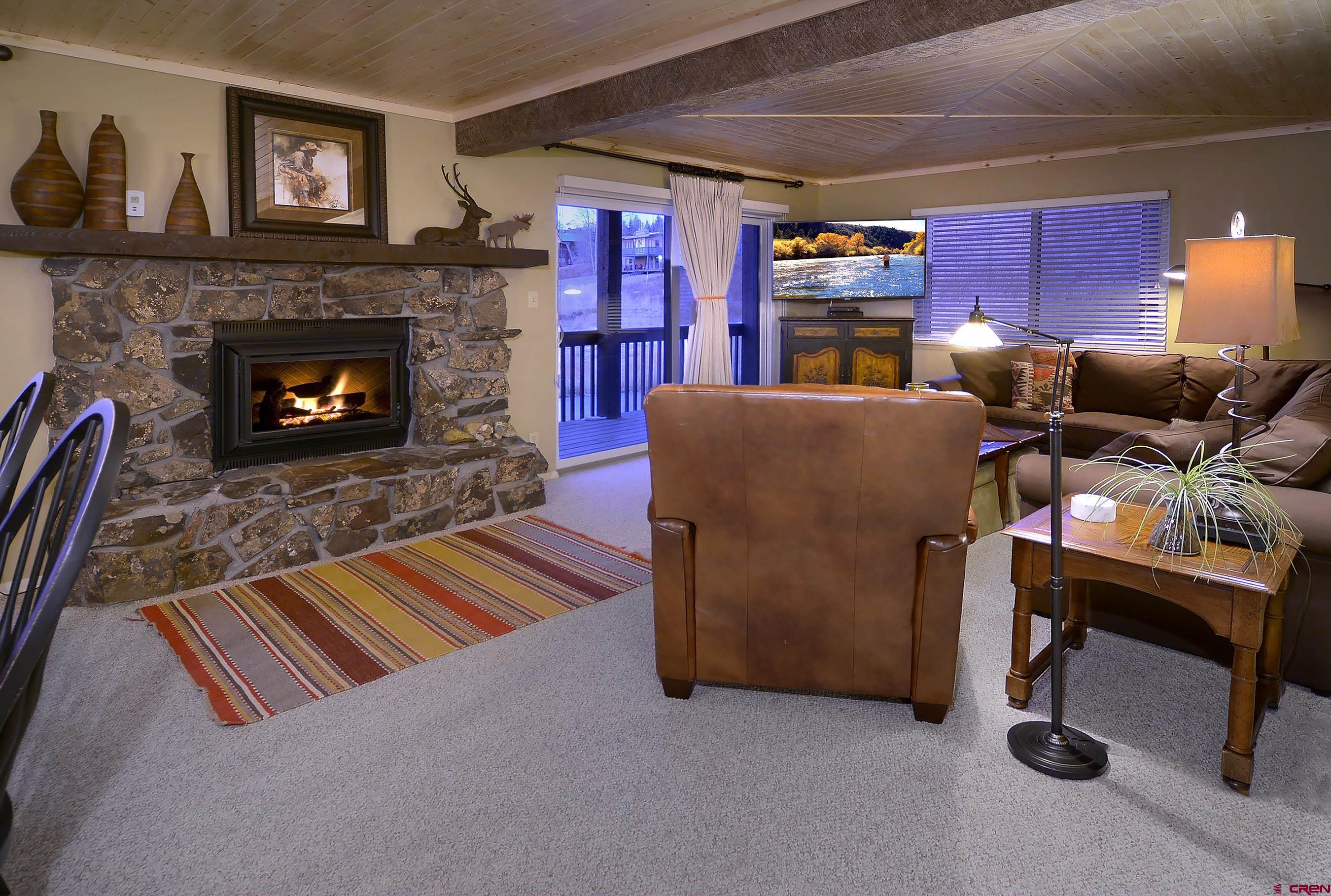 35 Emmons Road, Unit 3 Crested Butte, CO 81225 - Photo 3 of 25 a living room with furniture and a fireplace