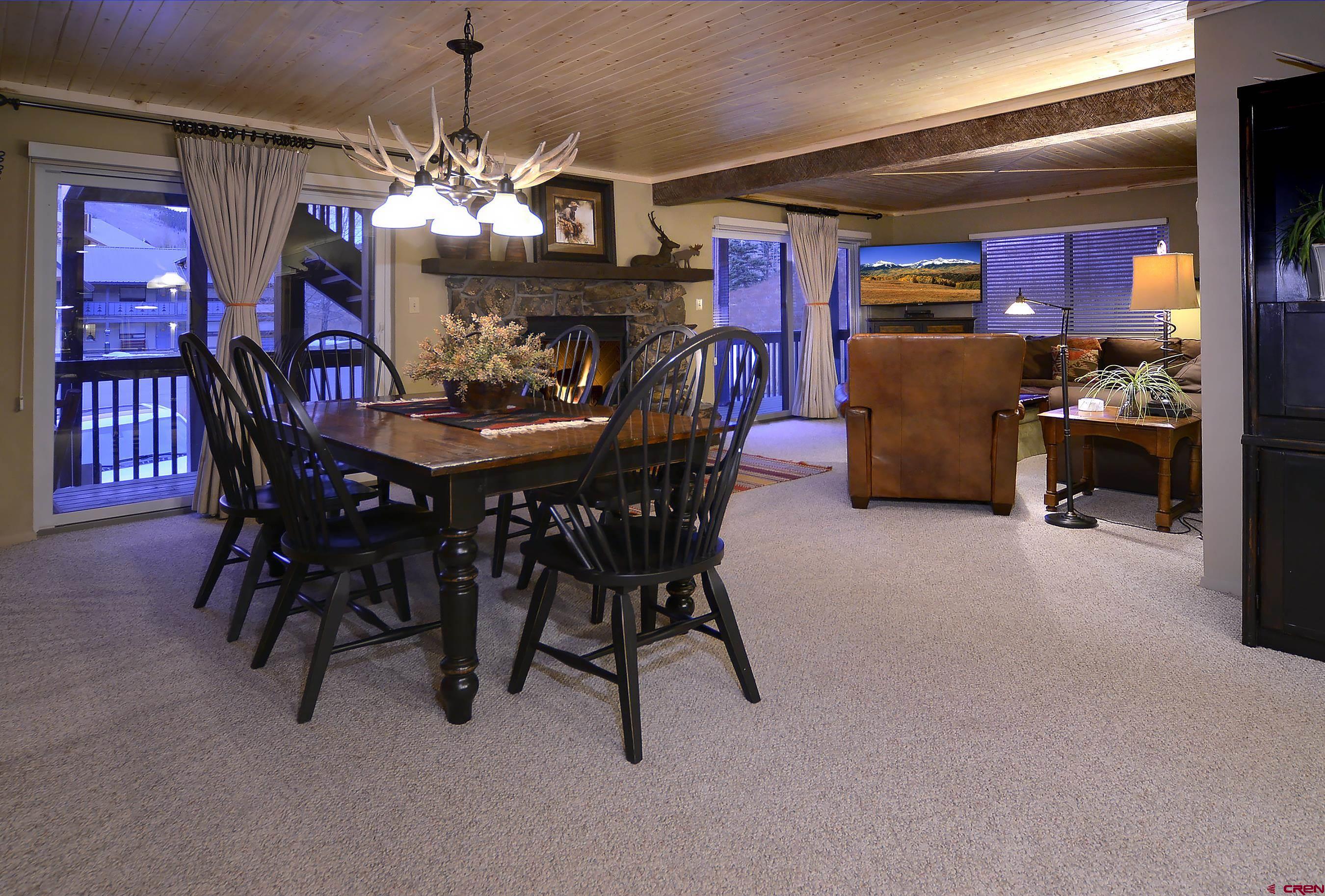 35 Emmons Road, Unit 3 Crested Butte, CO 81225 - Photo 4 of 25 a view of a dining room with furniture and chandelier