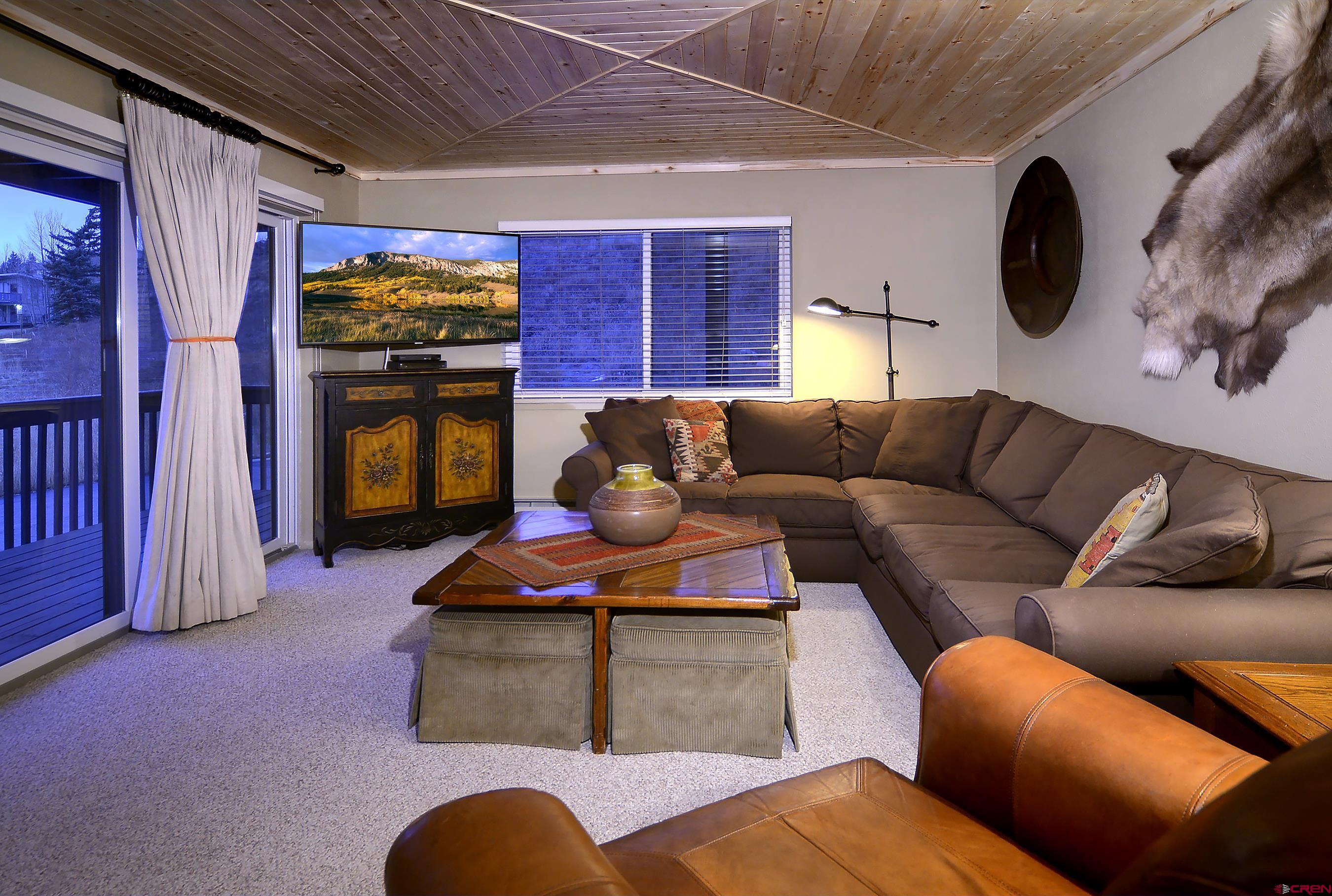 35 Emmons Road, Unit 3 Crested Butte, CO 81225 - Photo 7 of 25 a living room with furniture ceiling fan and a rug