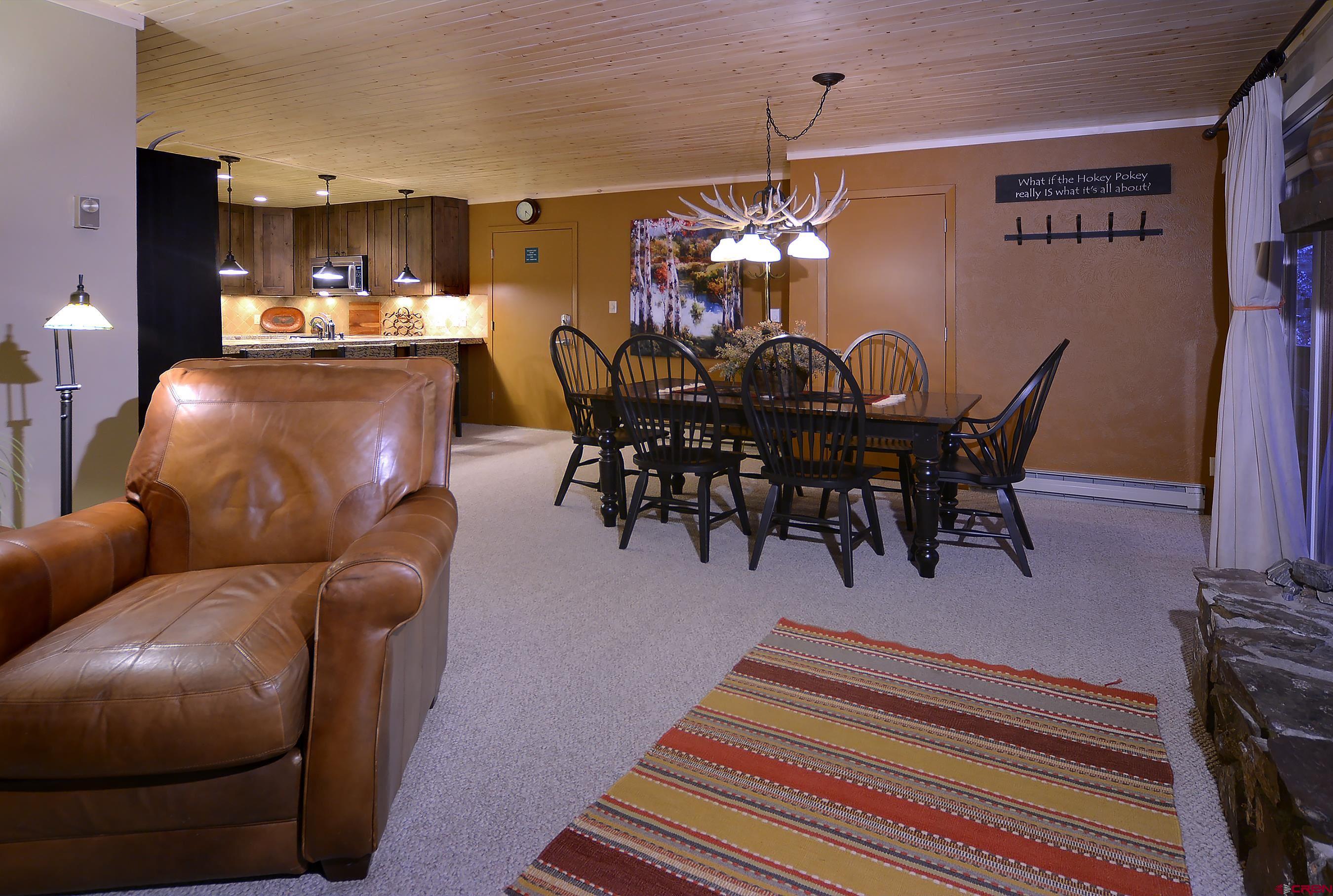 35 Emmons Road, Unit 3 Crested Butte, CO 81225 - Photo 8 of 25 a view of a dining room with furniture and chandelier