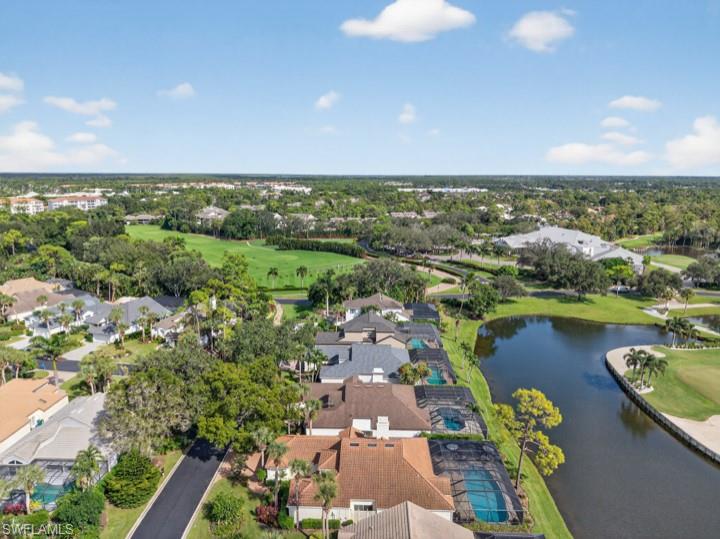 43 Grey Wing Point Naples, FL 34113 - Photo 11 of 50 Aerial perspective of suburban area featuring a large body of water and a local golf course