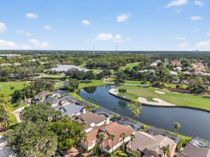 43 Grey Wing Point Naples, FL 34113 - Photo 12 of 50 Aerial perspective of suburban area featuring a local golf course and a large body of water