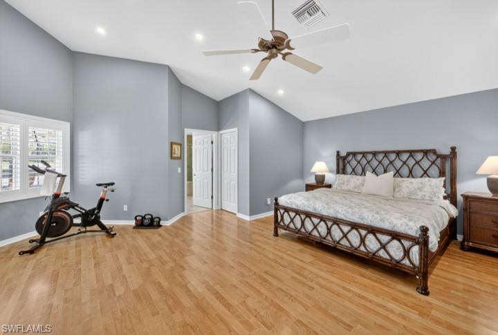43 Grey Wing Point Naples, FL 34113 - Photo 43 of 50 Bedroom with light wood-type flooring, high vaulted ceiling, a ceiling fan, and recessed lighting