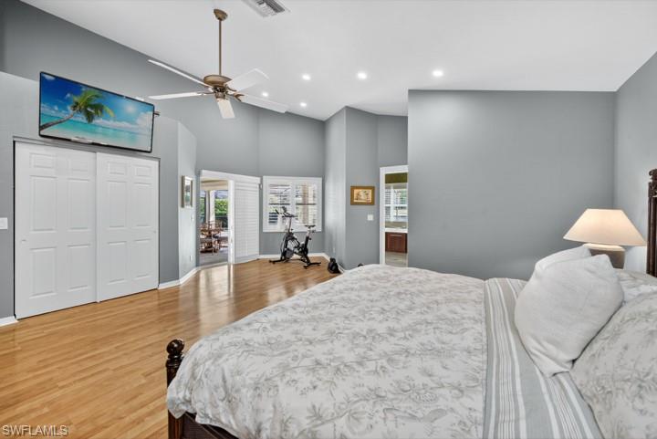 43 Grey Wing Point Naples, FL 34113 - Photo 44 of 50 Bedroom with high vaulted ceiling, light wood-style flooring, a closet, recessed lighting, and a ceiling fan