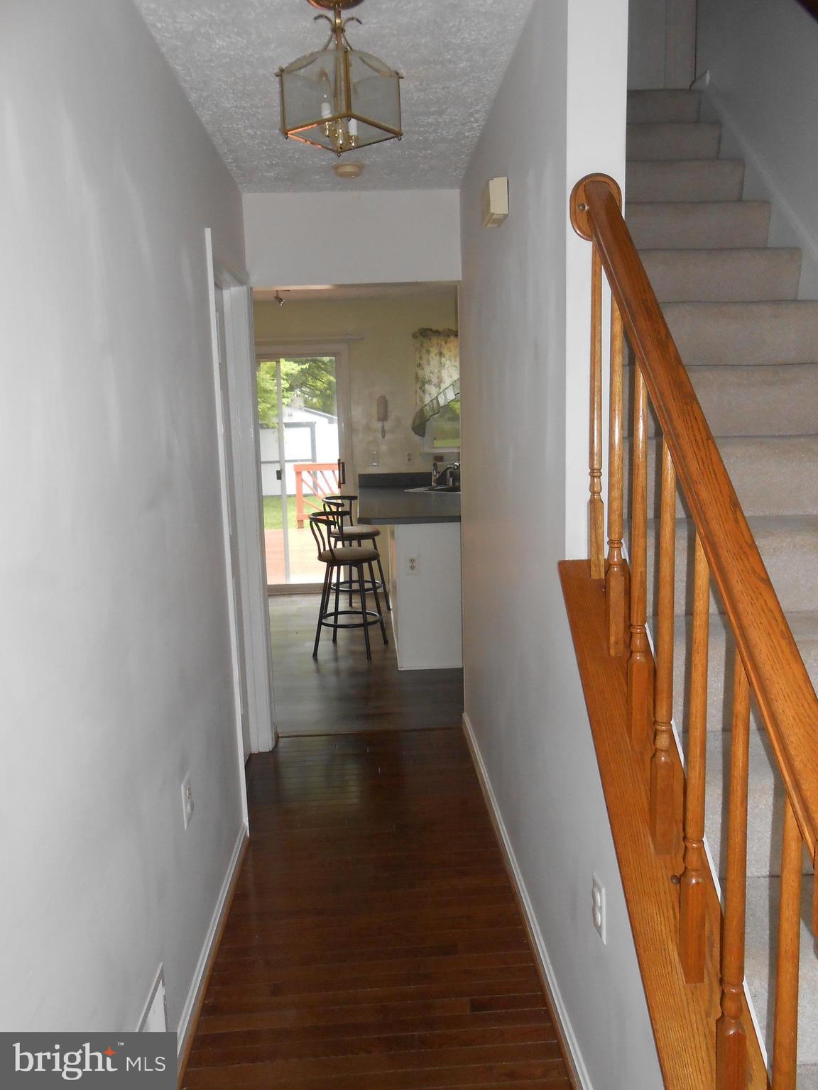 10472 Labrador Loop Manassas, VA 20112 - Photo 16 of 53 Hallway to Kitchen - Hardwood Floor