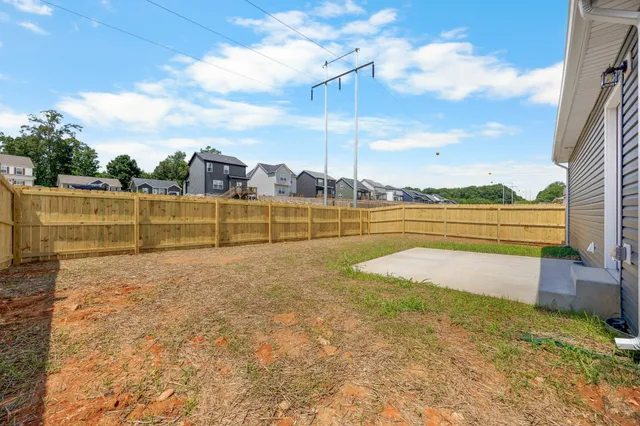 a view of swimming pool with outdoor seating and plants