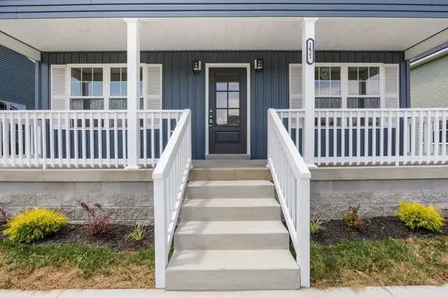 a view of a house with porch and wooden floor