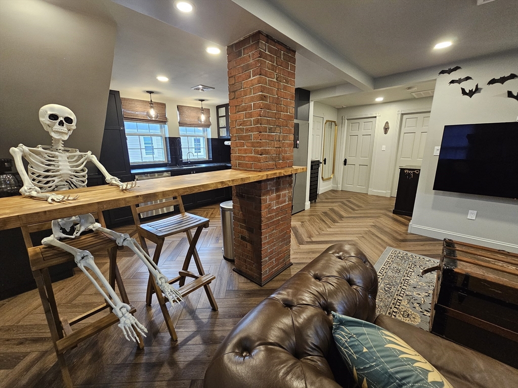 a living room with furniture and flat screen tv