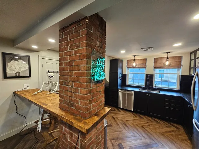 a kitchen with stainless steel appliances granite countertop a stove and a refrigerator