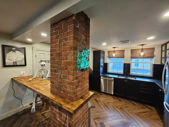 a kitchen with stainless steel appliances granite countertop a stove and a refrigerator