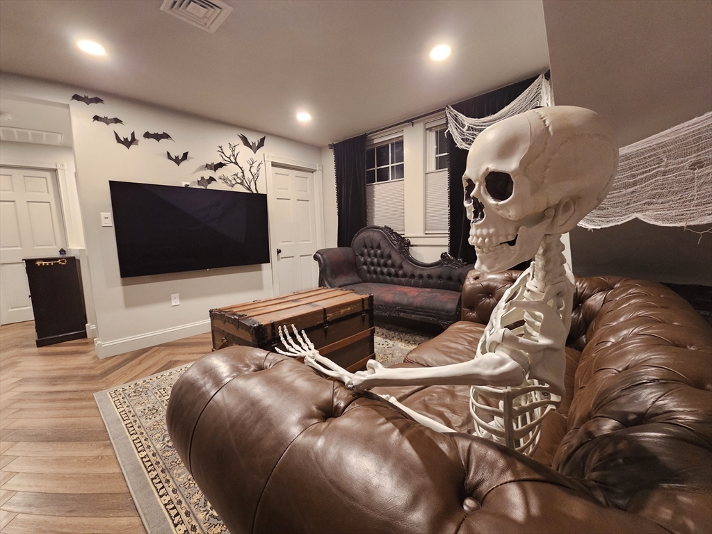 55 Buffum Street, Unit 3 Salem, MA 01970 - Photo 7 of 10 a living room with furniture and a flat screen tv