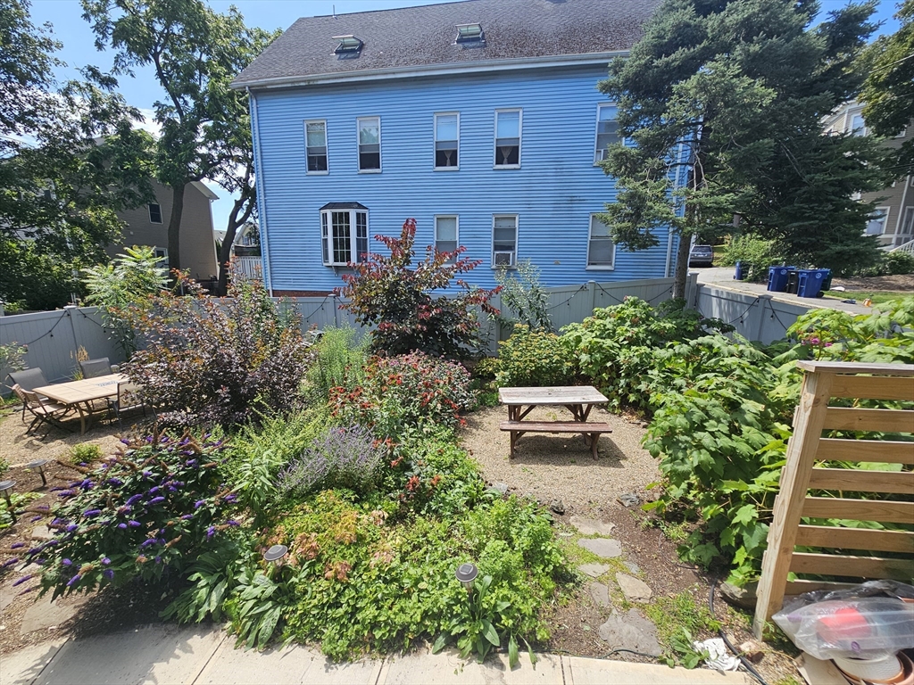 55 Buffum Street, Unit 3 Salem, MA 01970 - Photo 10 of 10 a view of a garden with plants