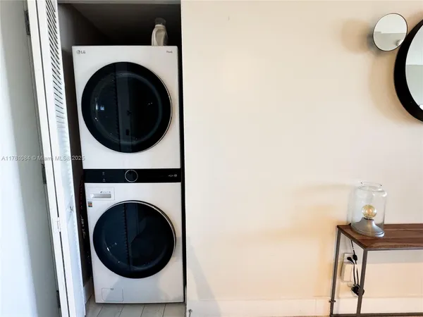 a close view of a utility room with dryer and washer
