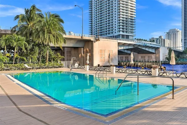a view of swimming pool with outdoor seating